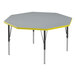 A grey and yellow hexagon table with black legs.