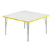 A white square Correll activity table with a yellow edge.