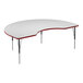 A white Correll activity table with a curved top and red trim.