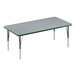 A rectangular Correll activity table with a gray top and green edges.