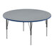 A round Correll activity table with a blue high-pressure laminate top and metal legs.