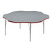 A grey table with a white top and red trim with silver legs.