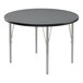 A round Correll activity table with silver legs and a black T-molded edge.