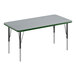 A rectangular table with a gray top and green border on black legs.