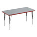 A rectangular gray activity table with black legs and red edges.