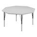 A white octagon activity table with black legs and gray trim.