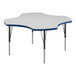 A white Correll activity table with blue T-mold and black legs.