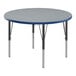 A Correll round activity table with a blue top and black legs.