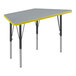 A grey trapezoid activity table with black and yellow legs.