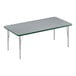 A rectangular table with a gray surface and silver legs.