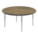 A Correll round activity table with a high-pressure laminate top and metal legs.