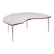 A white Correll kidney-shaped activity table with a red edge and metal legs.