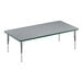 A Correll rectangular activity table with a gray top and metal legs with a green edge.