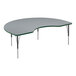 A grey table with a curved top and green edge supported by black metal legs.