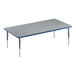 A rectangular Correll activity table with a gray top, blue edge, and metal legs.