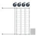 A white metal grid with black circles and metal poles.