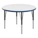 A white round Correll activity table with blue edges and black legs.