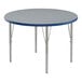 A Correll round activity table with a blue top and metal legs.
