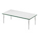 A white rectangular Correll activity table with silver legs and a green edge.