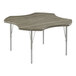 A Correll New England Driftwood activity table with silver metal legs and a driftwood surface.