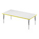 A white rectangular Correll activity table with a yellow edge.