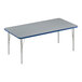 A rectangular Correll activity table with a gray top and blue edge with silver legs.