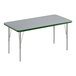 A rectangular activity table with a green border and silver legs.