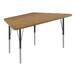A trapezoid shaped Correll activity table with a medium oak top and black legs.