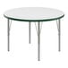 A Correll white round activity table with green and silver legs.