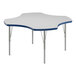 A white and blue table with a star shape and silver legs.