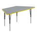 A grey and yellow trapezoid-shaped Correll activity table.