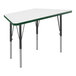 A white trapezoid activity table with green T-mold on the edge and black metal legs.