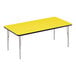 A yellow rectangular Correll activity table with silver legs and black edges.