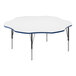 A white Correll activity table with a blue flower-shaped edge.