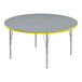 A round grey high-pressure laminate activity table with yellow T-mold.