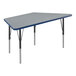 A grey trapezoid activity table with black legs and blue T-Mold.