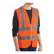 A person wearing a Lavex orange safety vest with reflective stripes.