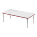 A white rectangular Correll activity table with a red edge.