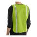 A man wearing a Lavex lime high visibility safety vest with reflective stripes.