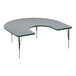 A grey table with a half-moon shaped top and black metal base with green edges.