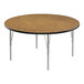 A Correll round activity table with medium oak laminate top and silver legs.