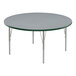A round Correll activity table with gray top and metal legs with green edges.