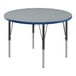 A Correll round activity table with a gray top and black legs.