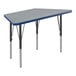 A grey trapezoid-shaped Correll activity table with black legs and blue T-mold.