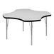 A white Correll activity table with black edges and silver legs.