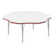 A white Correll activity table with a red flower-shaped edge.