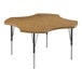 A Correll activity table with a medium oak clover-shaped top and black metal legs.