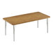 A brown rectangular Correll activity table with silver legs and a wooden top.