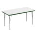 A white rectangular Correll activity table with green T-mold.