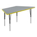 A grey and yellow trapezoid activity table with black legs.